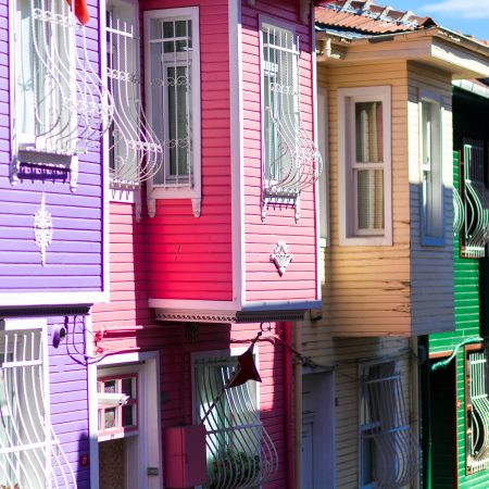 Row Of Colourful Exterior Wood Houses